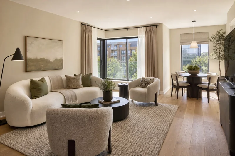 Refined larger apartment living and dining space in ivory, oak and olive tones